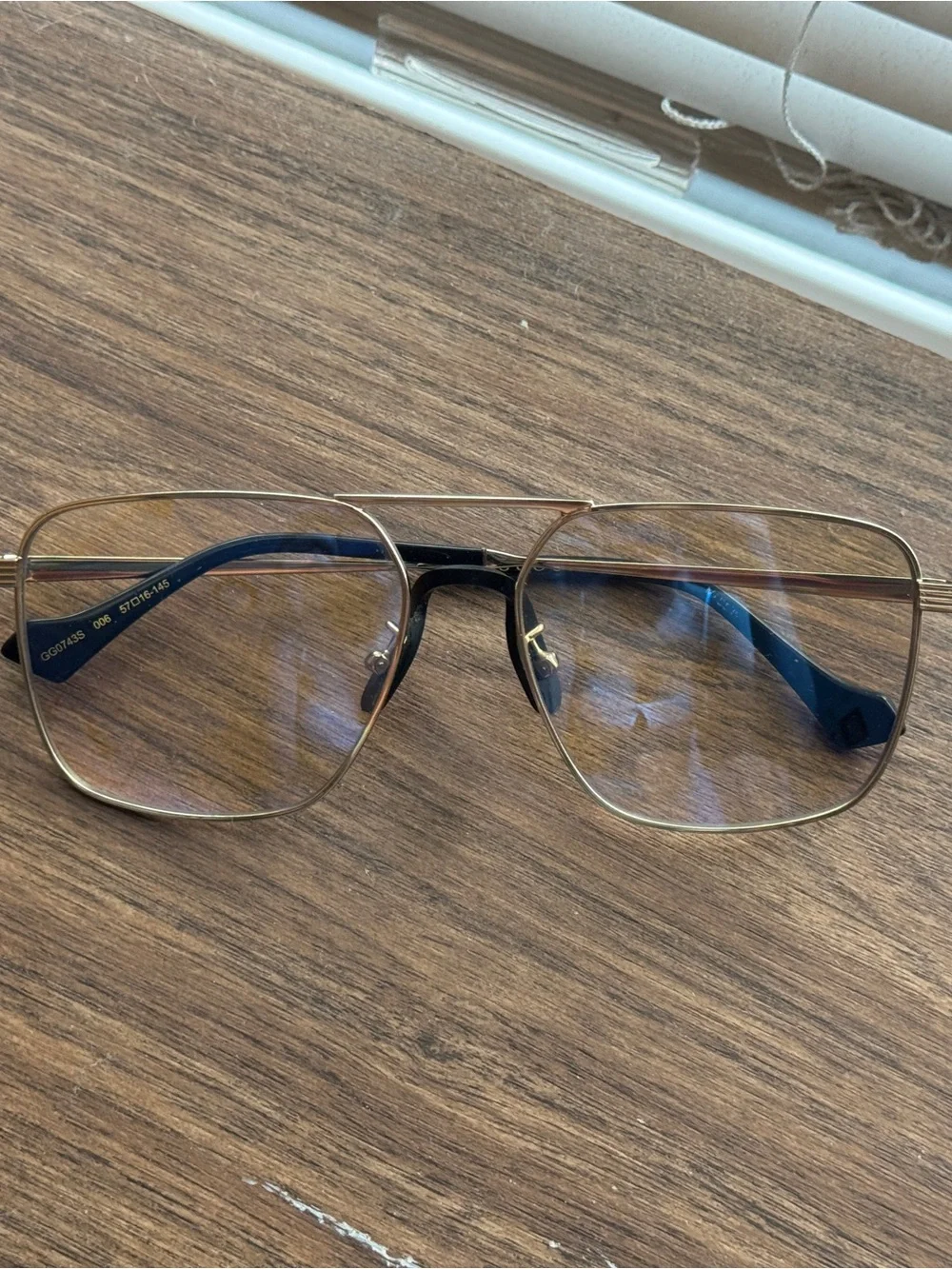 Gucci Women’s Gold Frame Sunglasses with Champagne Polarized Lenses